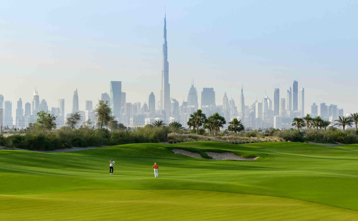 The Dubai Hills golf course with the Downtown skyline behind