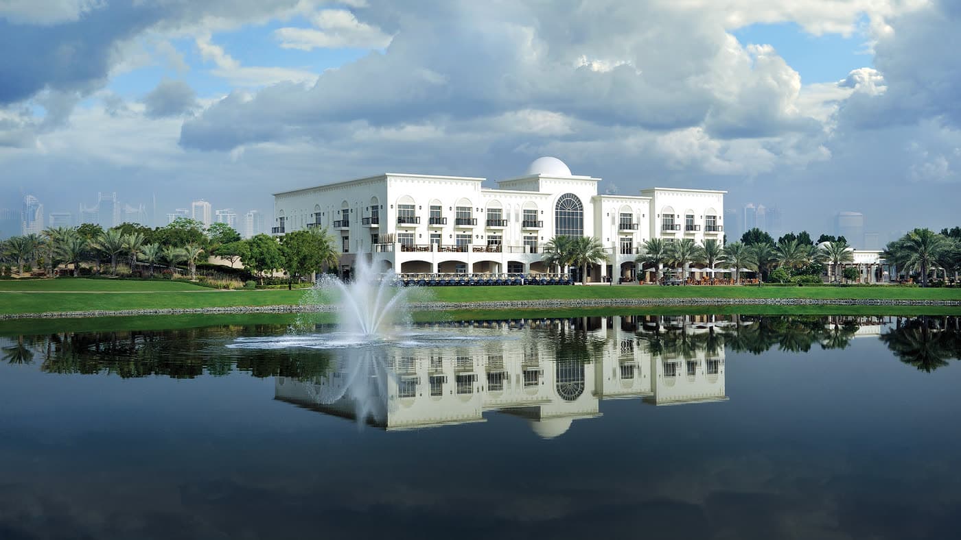 The Montgomerie clubhouse and lake at Emirates Hills