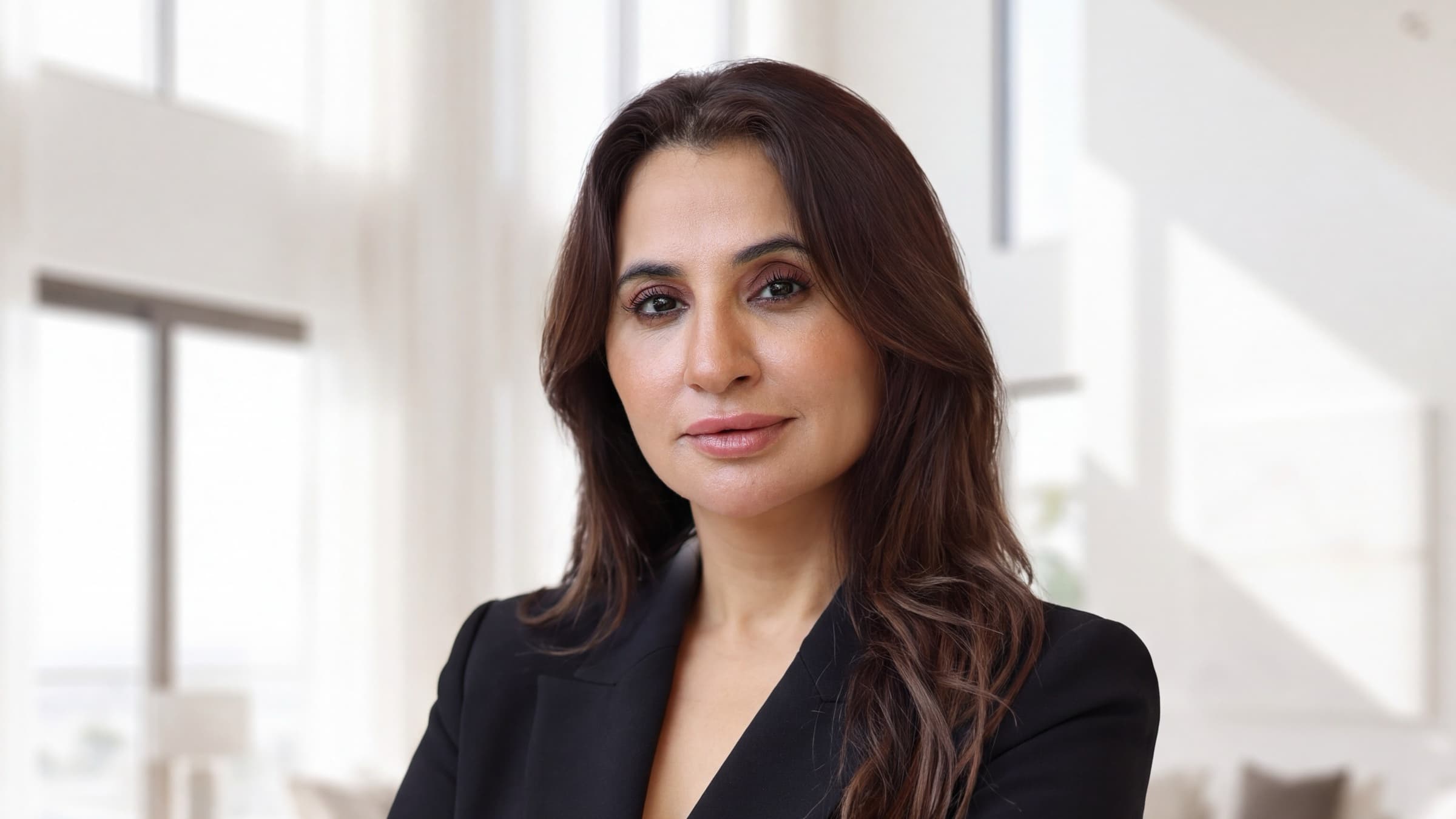 Leena Parwani, founder of Silver Spoon Properties, in a villa living room in Dubai.